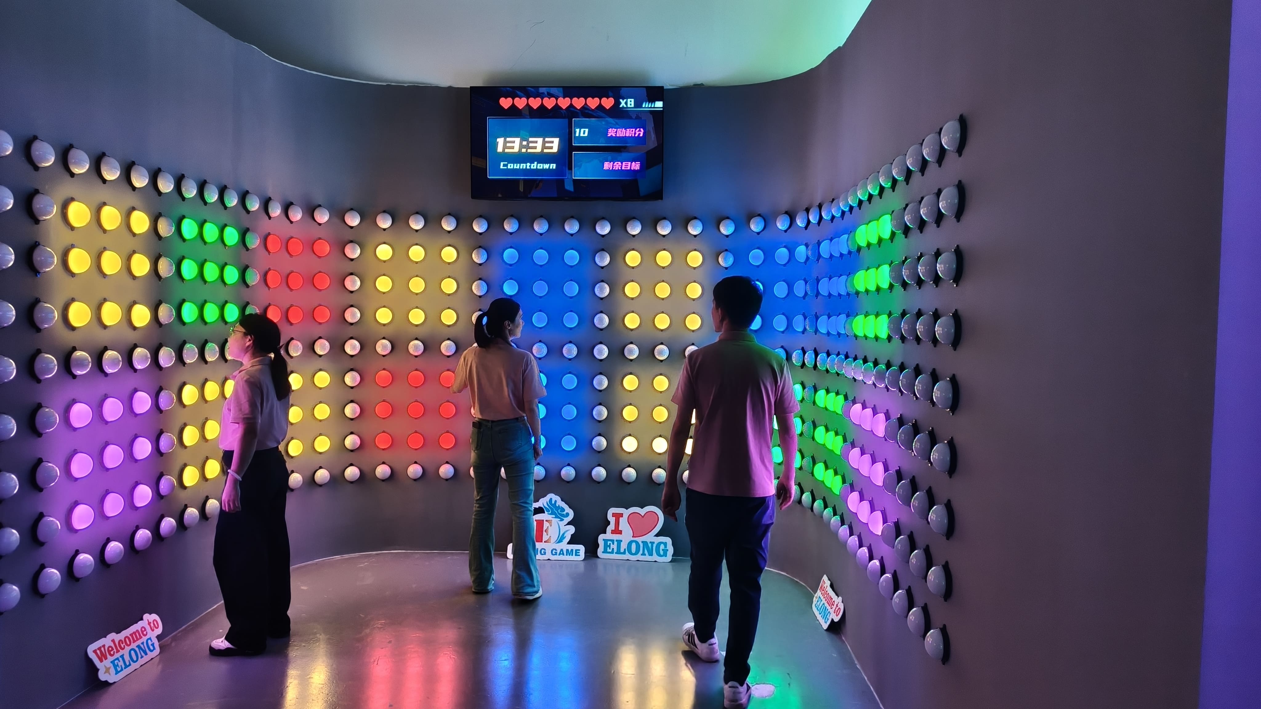 Guests testing an ELONG interactive reaction game room